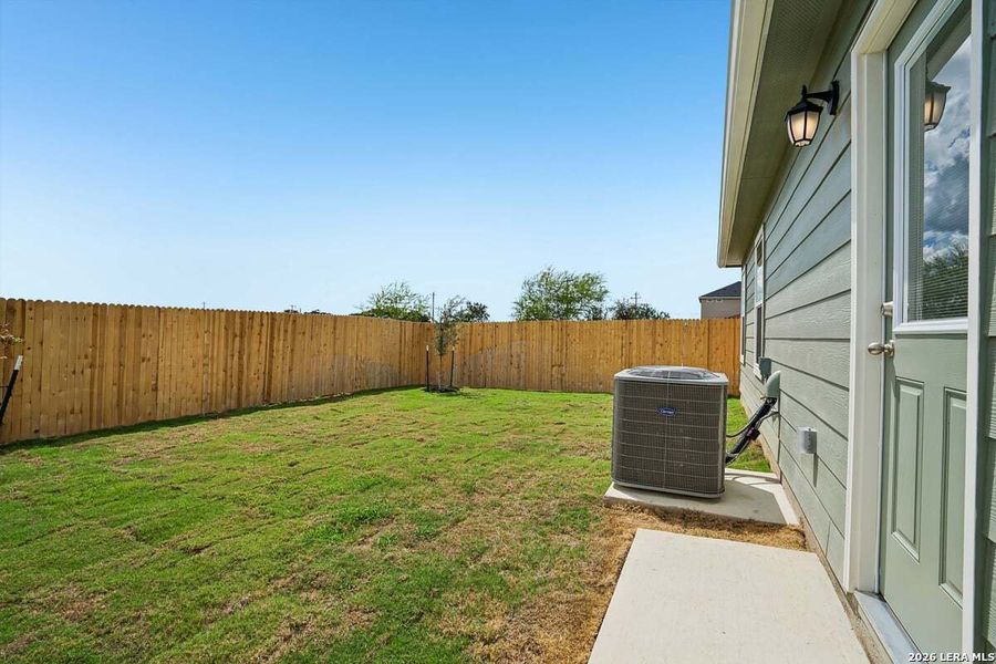 Exterior details and patio area of a home in Southton Cove, Elmendorf (Image 3).