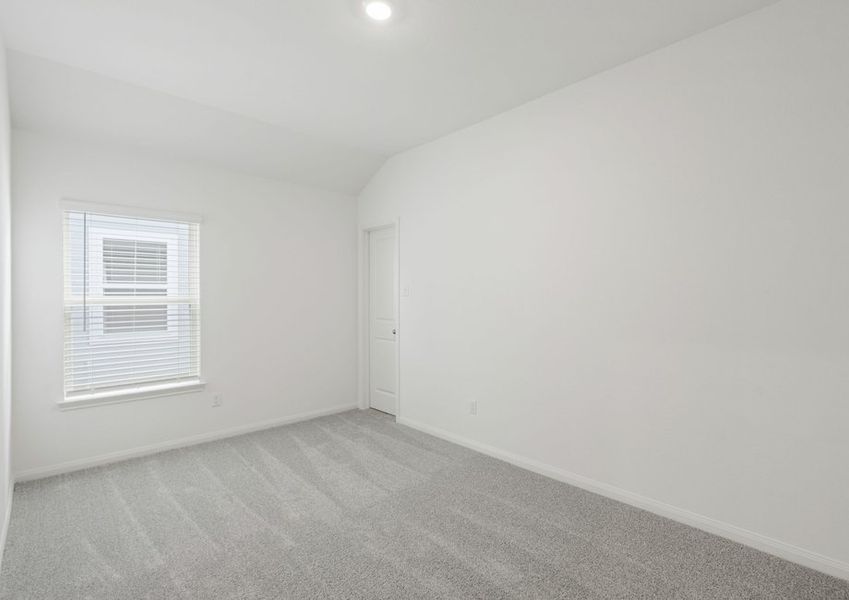 Bedroom with lush carpet flooring Bedroom with lush carpet flooring