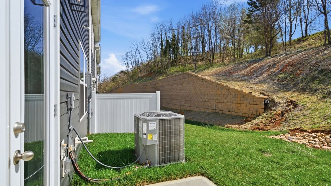 Exterior details and patio area of a home in The Arbor Townhomes, Kingsport (Image 21).
