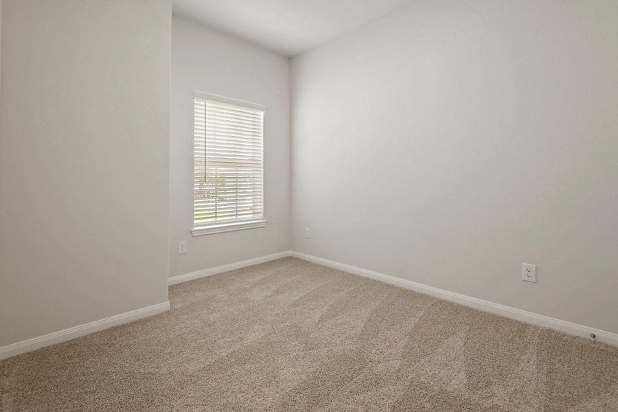 In addition to the primary suite, this home has three additional bedrooms.