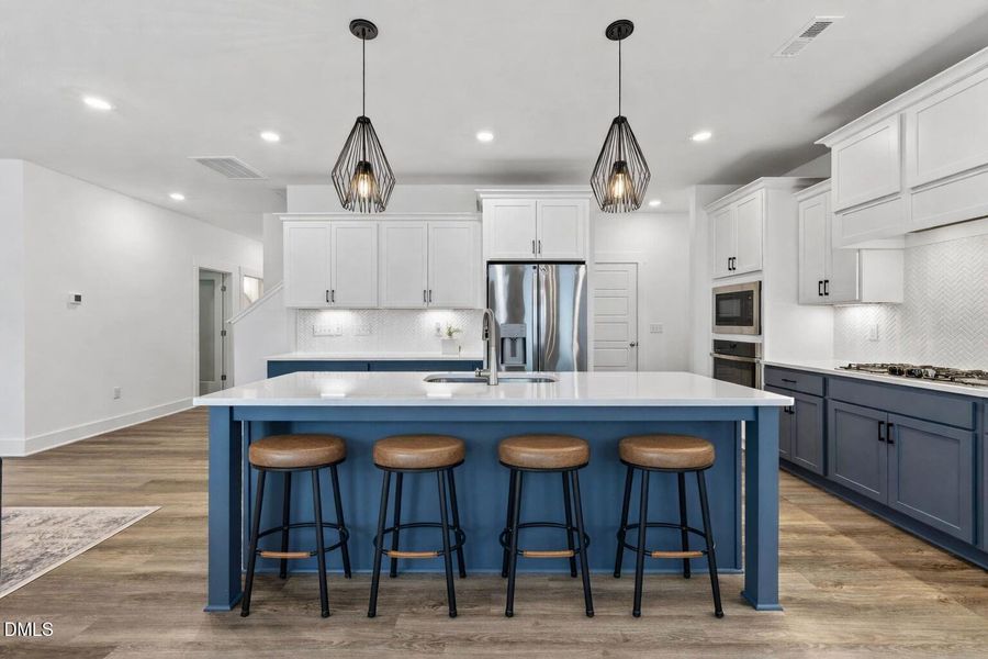 Modern kitchen with blue island and stoo Modern kitchen with blue island and stoo