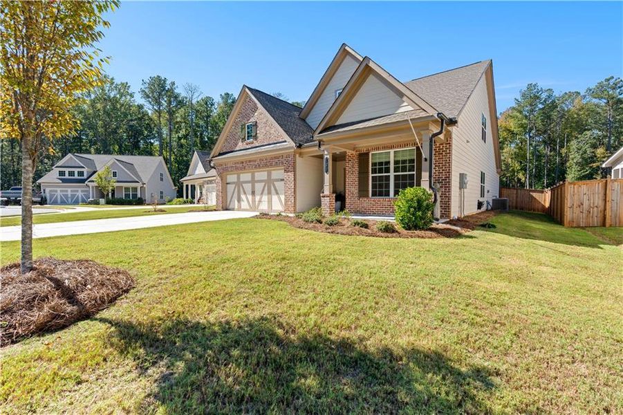 Front exterior of a new home in Candleberry Place, Sharpsburg, GA, highlighting curb appeal (Image 22).