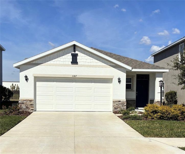 Front exterior of a new home in Star Farms at Lakewood Ranch, Bradenton, FL, highlighting curb appeal (Image 1). Front exterior of a new home in Star Farms at Lakewood Ranch, Bradenton, FL, highlighting curb appeal (Image 1).