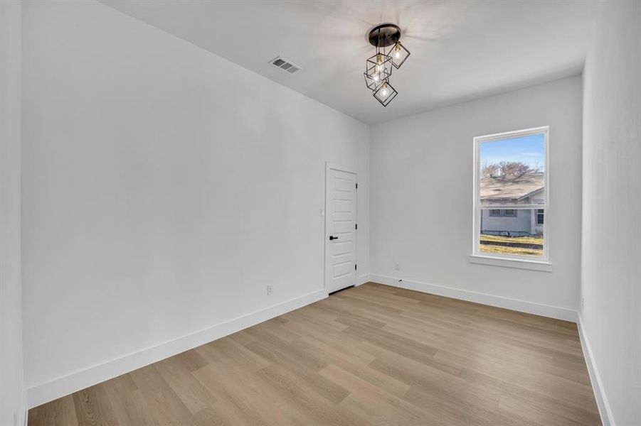 Unfurnished room with light hardwood / wood-style floors