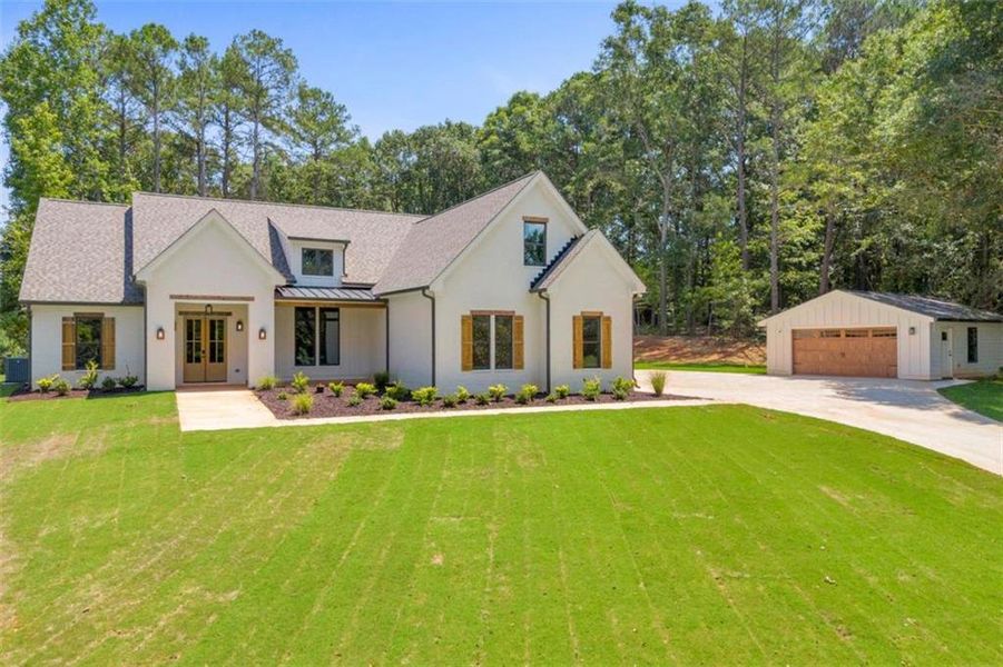 Front exterior of a new home in , Monroe, GA, highlighting curb appeal (Image 25). Front exterior of a new home in , Monroe, GA, highlighting curb appeal (Image 25).