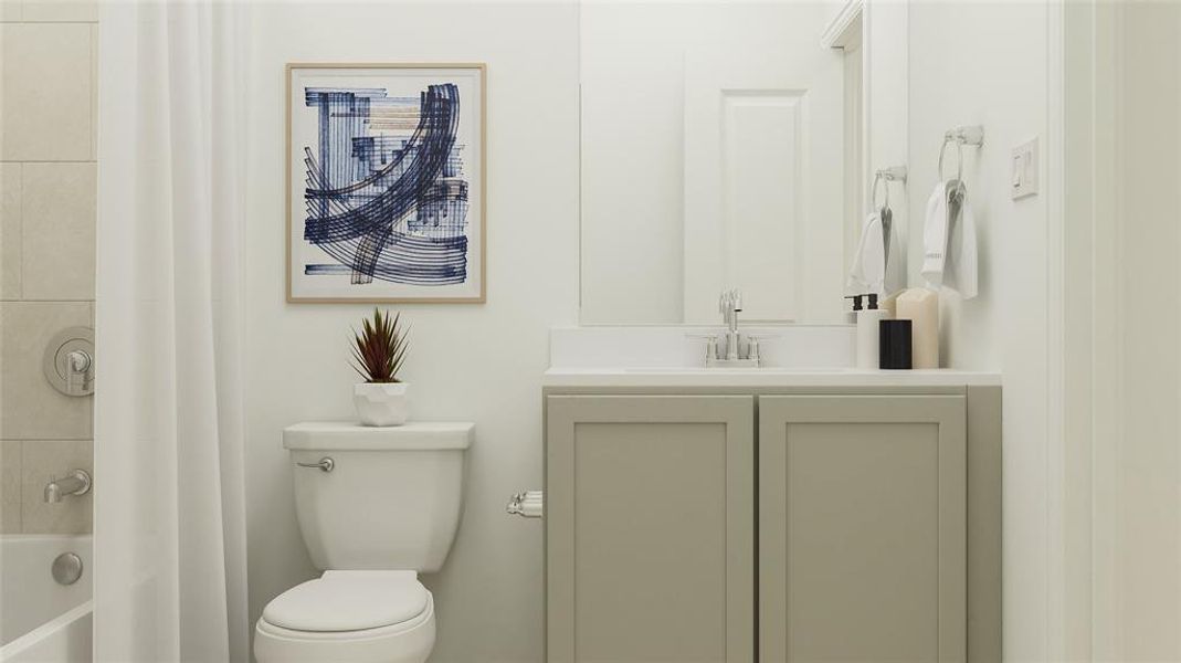 Full bathroom with vanity, tiled shower / bath combo, and toilet