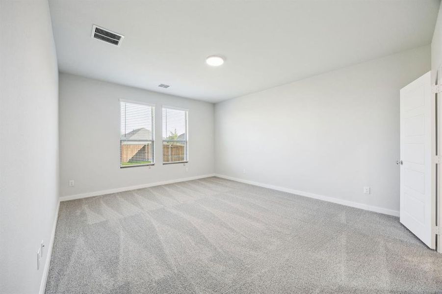 Primary Suite in the Masters home plan by Trophy Signature Homes – REPRESENTATIVE PHOTO