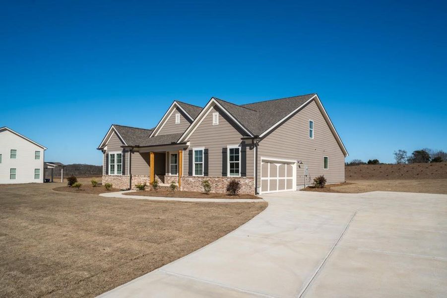 Front exterior of a new home in Magnolia Ridge, Monroe, GA, highlighting curb appeal (Image 21).