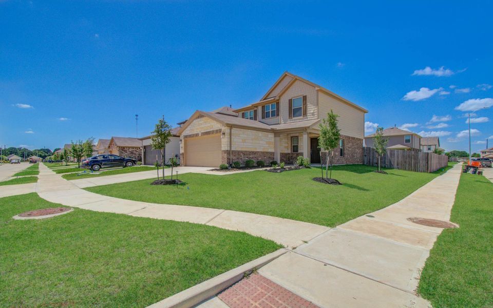 Front exterior of a new home in , Hockley, TX, highlighting curb appeal (Image 19).