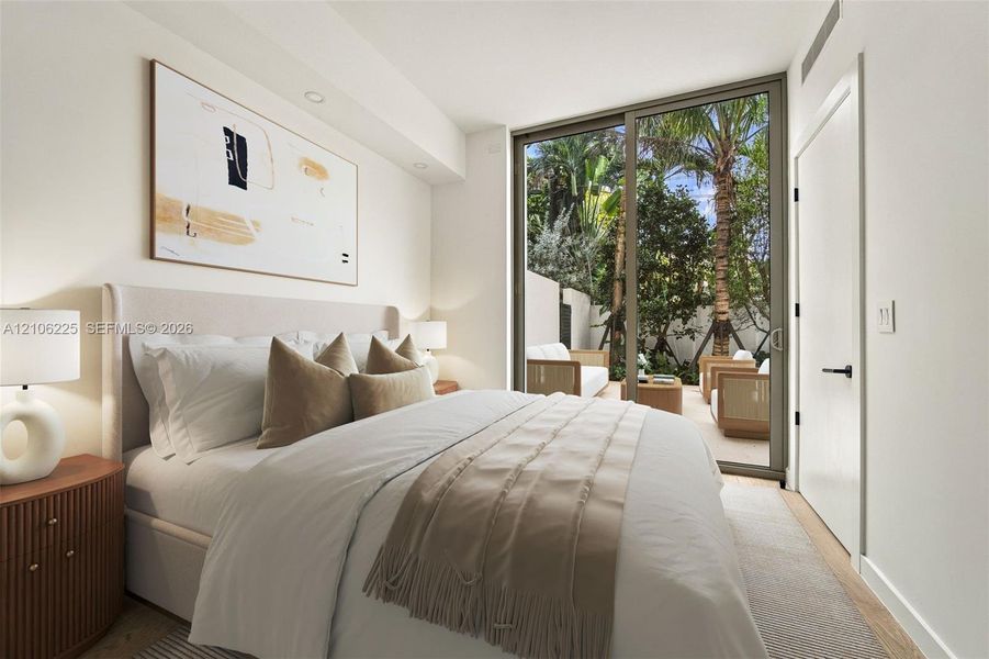 Floor-to-ceiling glass sliding door, recessed lighting, and smooth-finish walls Floor-to-ceiling glass sliding door, recessed lighting, and smooth-finish walls