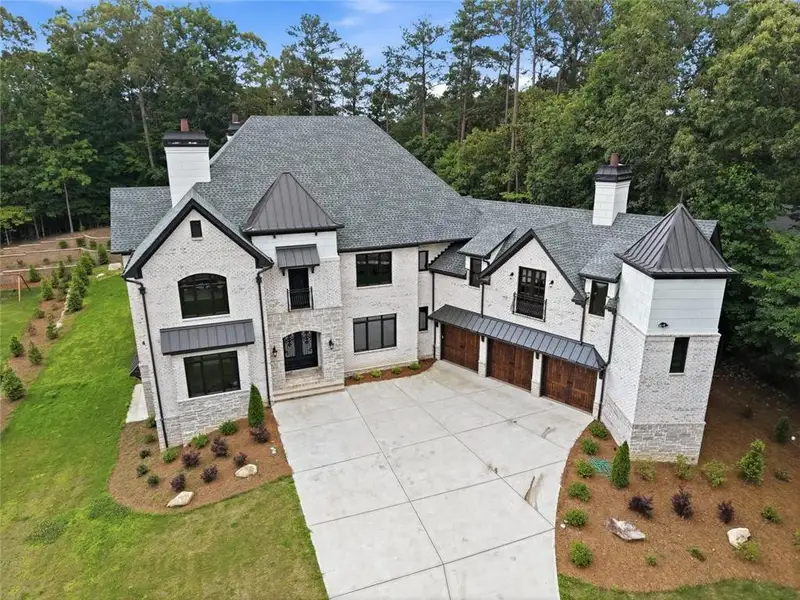 Front exterior of a new home in , Roswell, GA, highlighting curb appeal (Image 2).
