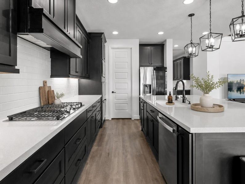 A well-appointed kitchen showcasing a central island and contemporary fixtures perfect for culinary creations. A well-appointed kitchen showcasing a central island and contemporary fixtures perfect for culinary creations.