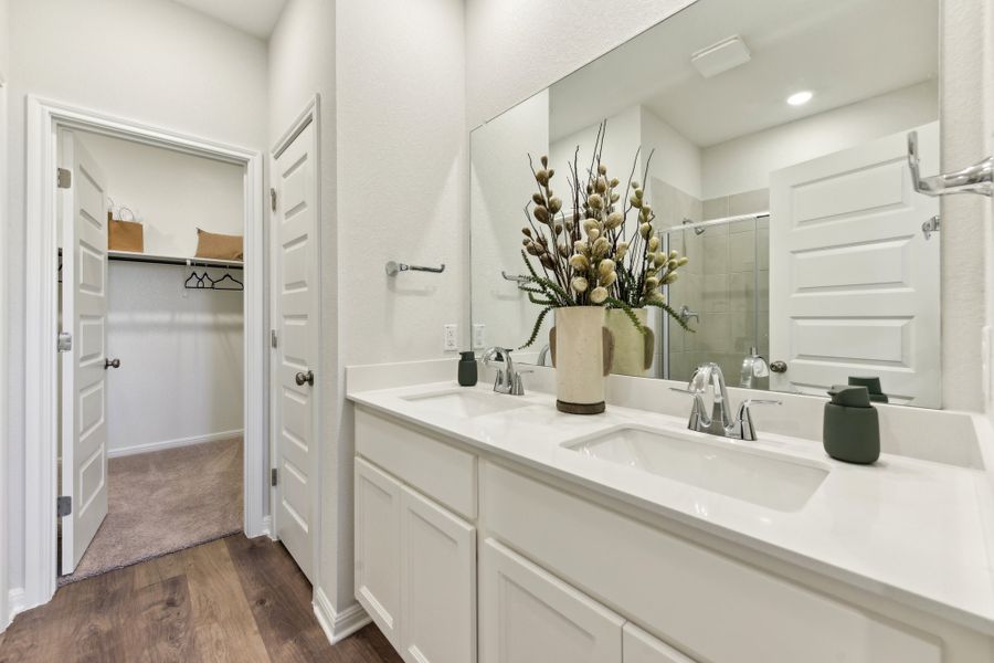 A bathroom with a large mirror. A bathroom with a large mirror.