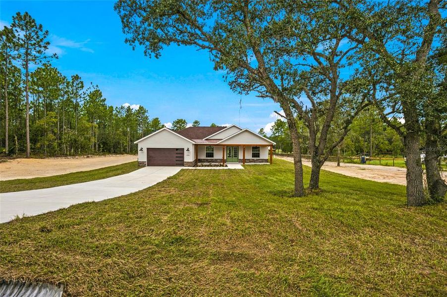 Front exterior of a new home in , Dunnellon, FL, highlighting curb appeal (Image 22). Front exterior of a new home in , Dunnellon, FL, highlighting curb appeal (Image 22).