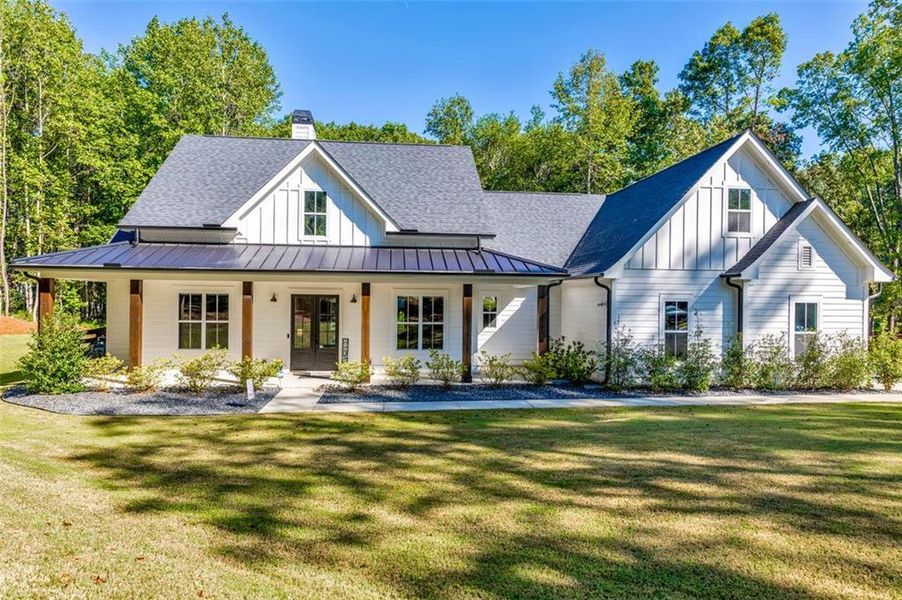 Front exterior of a new home in , Woodstock, GA, highlighting curb appeal (Image 2).