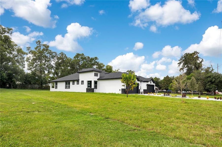Front exterior of a new home in , Apopka, FL, highlighting curb appeal (Image 34).