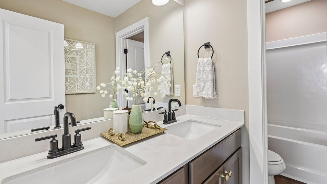 Spacious secondary bathroom with dual vanity