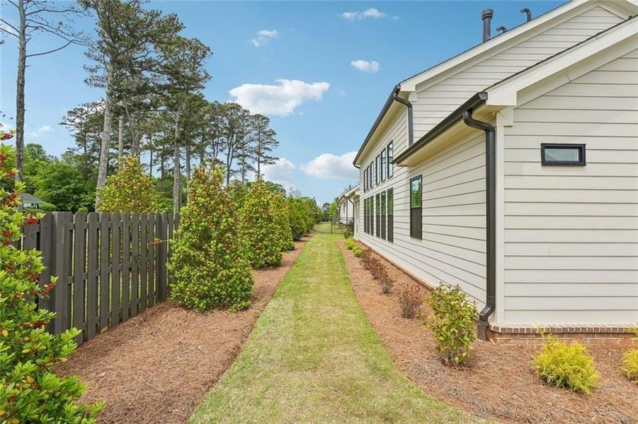 Exterior details and patio area of a home in Promenade at Sawnee Village, Cumming (Image 35). Exterior details and patio area of a home in Promenade at Sawnee Village, Cumming (Image 35).