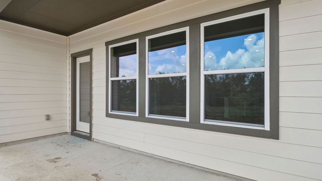 Exterior details and patio area of a home in Prairie Lakes, Buda (Image 20).