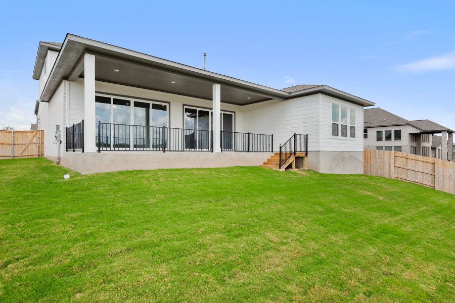 Exterior details and patio area of a home in Lariat, Liberty Hill (Image 27).