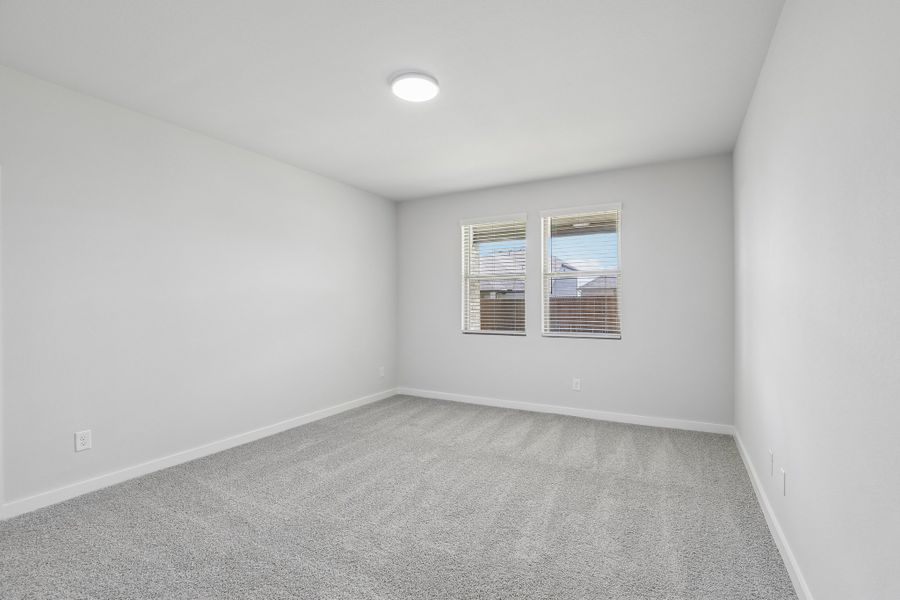 Primary Bedroom in the Holden home plan by Trophy Signature Homes