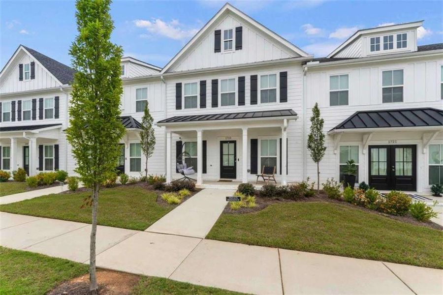 Front exterior of a new home in , Conyers, GA, highlighting curb appeal (Image 2). Front exterior of a new home in , Conyers, GA, highlighting curb appeal (Image 2).
