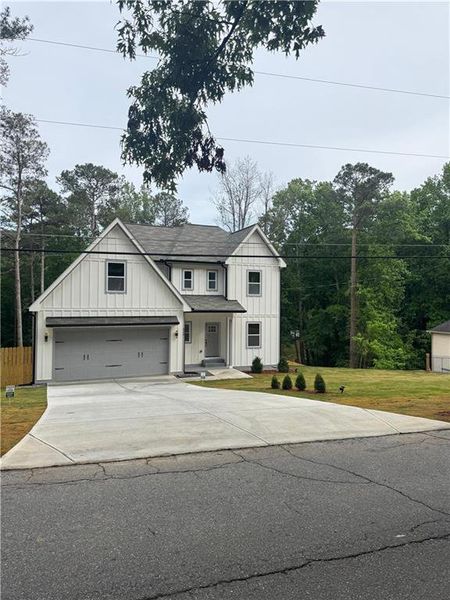 Front exterior of a new home in , Mableton, GA, highlighting curb appeal (Image 15).