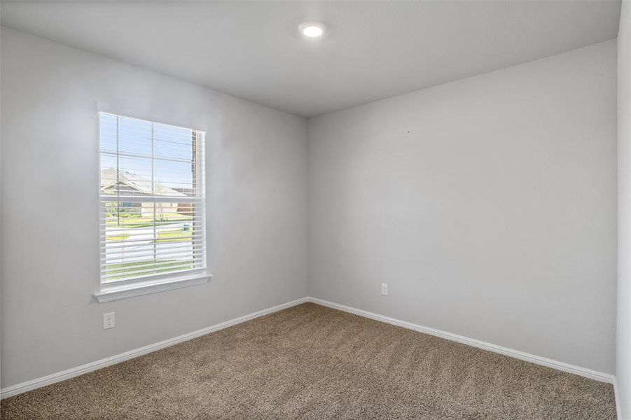 Unfurnished room with carpet flooring