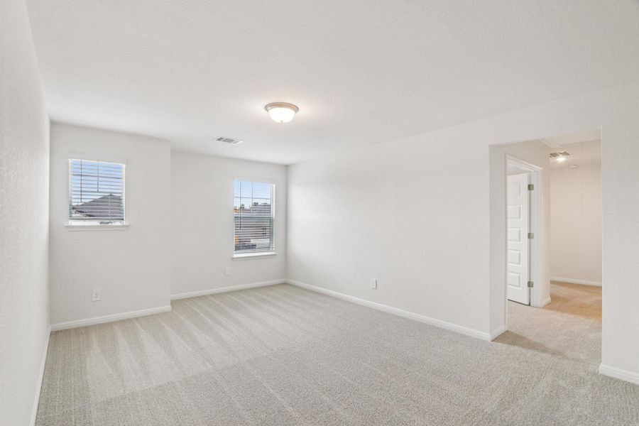 Spare room featuring light carpet Spare room featuring light carpet
