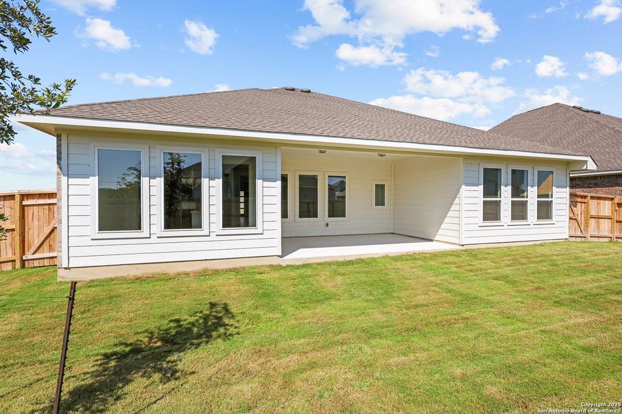 Front exterior of a new home in Megan's Landing, Castroville, TX, highlighting curb appeal (Image 17).