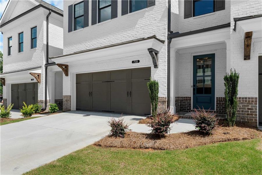 Exterior details and patio area of a home in Millcroft Townhomes, Buford (Image 23). Exterior details and patio area of a home in Millcroft Townhomes, Buford (Image 23).