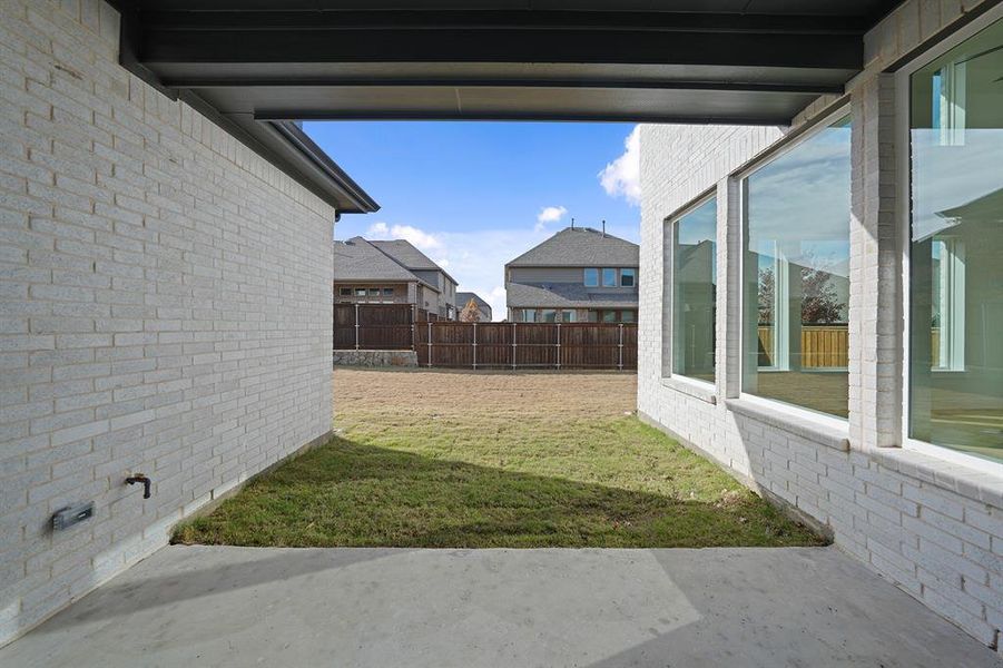Exterior details and patio area of a home in Estates at Rockhill, Frisco (Image 4).