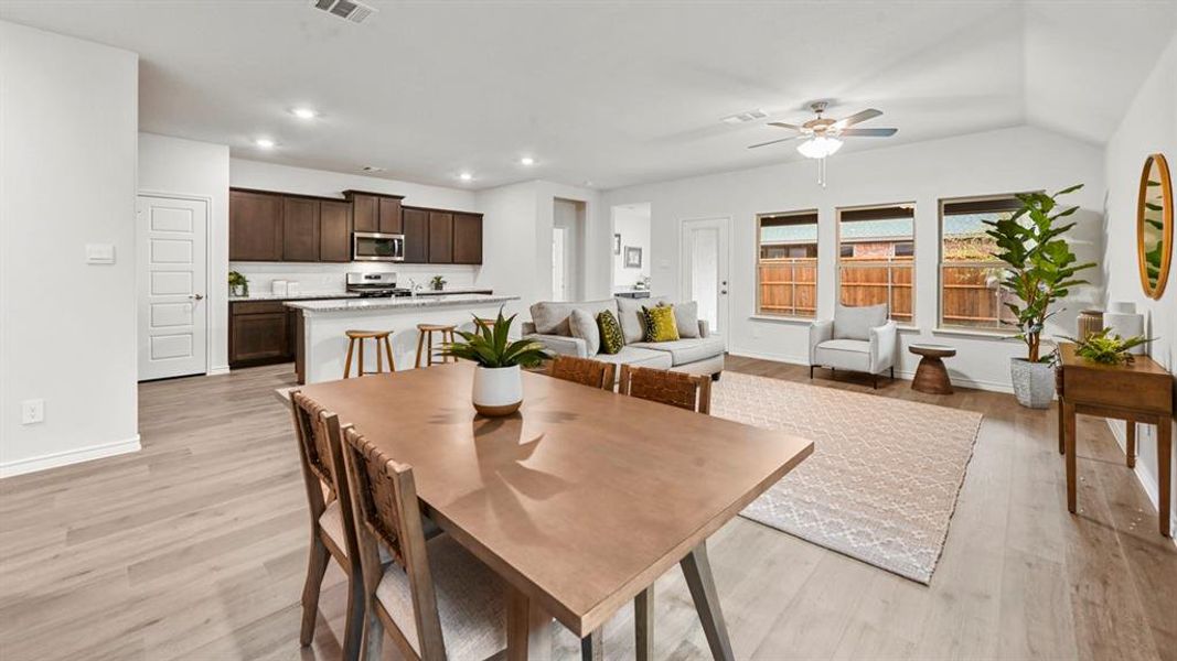 Dining room featuring a ceiling fan, light wood-type flooring, and recessed lighting