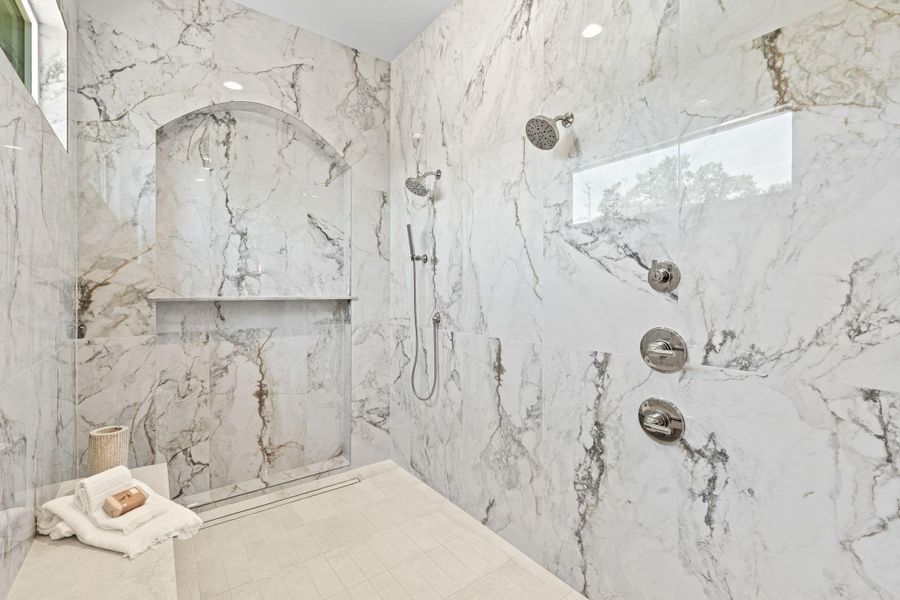 Dual shower heads plus hand held at oversized shower Dual shower heads plus hand held at oversized shower