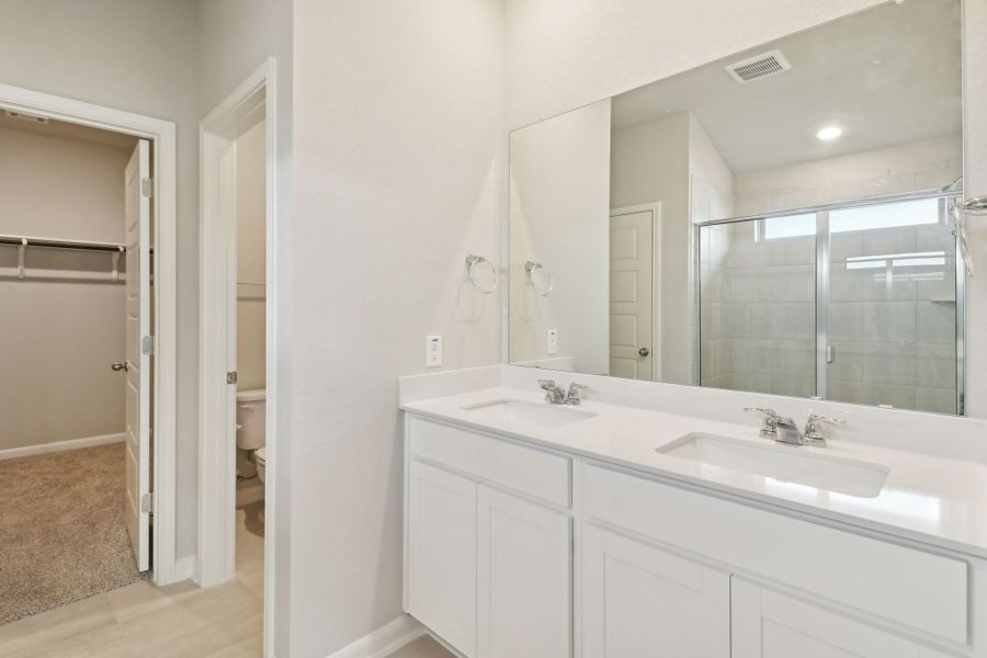 Primary suite bathroom in the Callaghan floorplan at a Meritage Homes community.