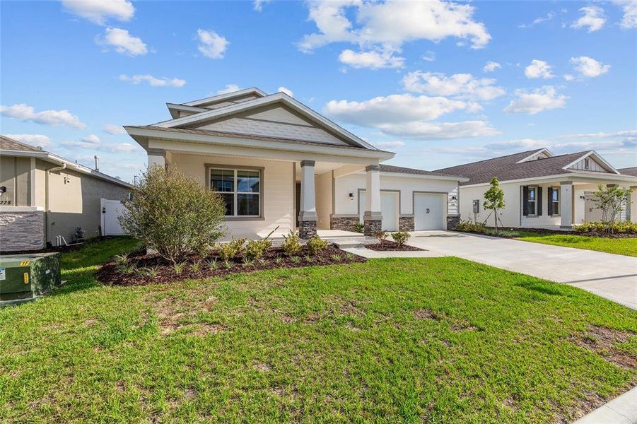 Front exterior of a new home in Calesa Township, Ocala, FL, highlighting curb appeal (Image 18). Front exterior of a new home in Calesa Township, Ocala, FL, highlighting curb appeal (Image 18).