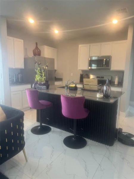 Furnished interior view inside a new home in EverBe, Orlando (Image 4).