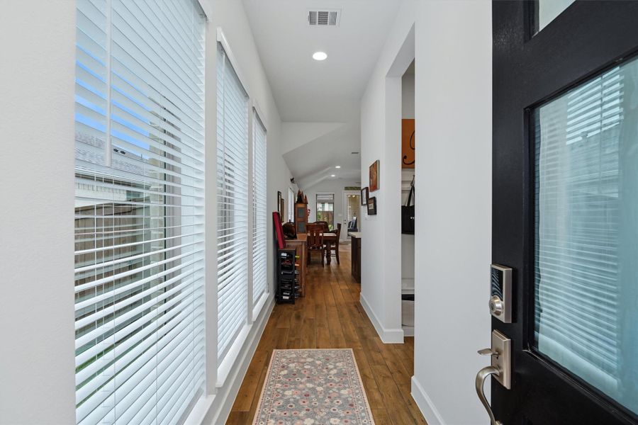 Light and bright entryway, wall of windows letting in natural light, tile floors Light and bright entryway, wall of windows letting in natural light, tile floors