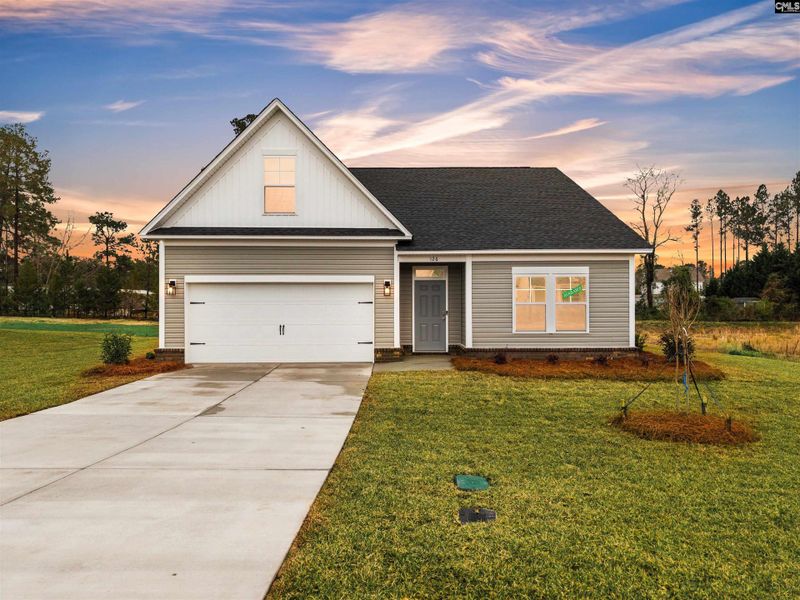 Front exterior of a new home in Raglins Creek, Lugoff, SC, highlighting curb appeal (Image 1). Front exterior of a new home in Raglins Creek, Lugoff, SC, highlighting curb appeal (Image 1).