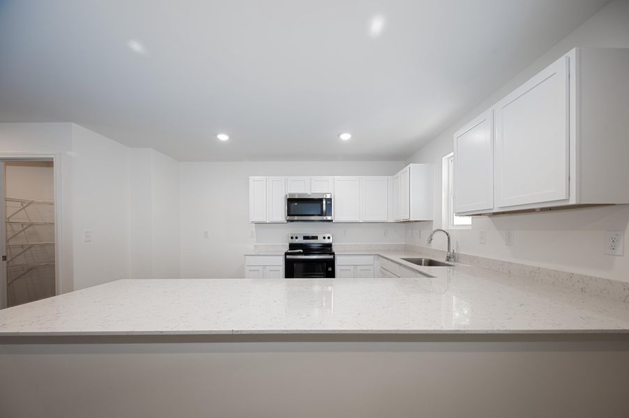 kitchen 3 - augusta - unfurnished + quartz - se arrowhead by the lake