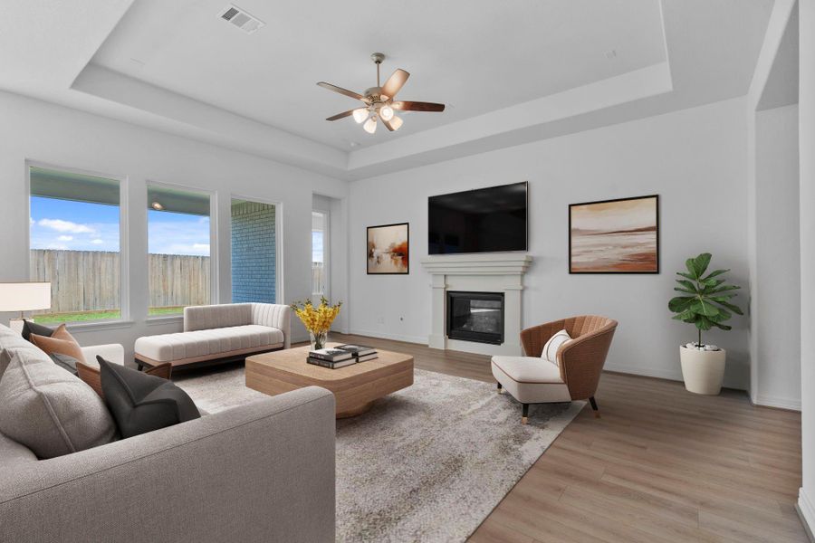 Your family room has ample space to entertain family and friends. This space features beautiful floors, fresh paint, ceiling fan with lighting, and high ceilings.
