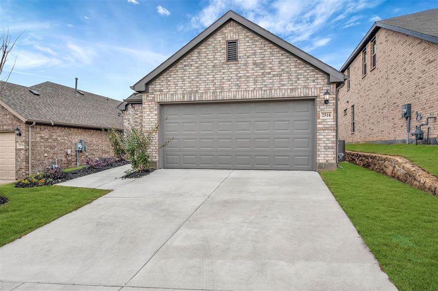 Front exterior of a new home in ValleyBrooke, Mesquite, TX, highlighting curb appeal (Image 23).