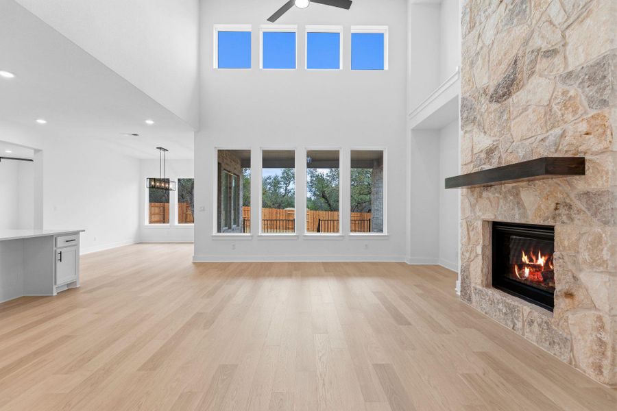 Family Room with soaring ceiling & fireplace