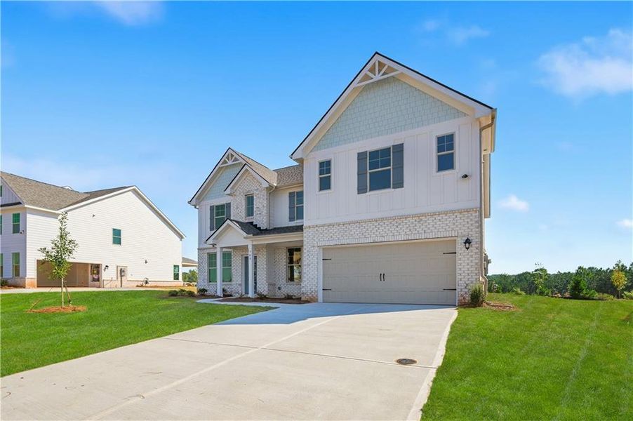 Front exterior of a new home in Brighton, Locust Grove, GA, highlighting curb appeal (Image 2). Front exterior of a new home in Brighton, Locust Grove, GA, highlighting curb appeal (Image 2).