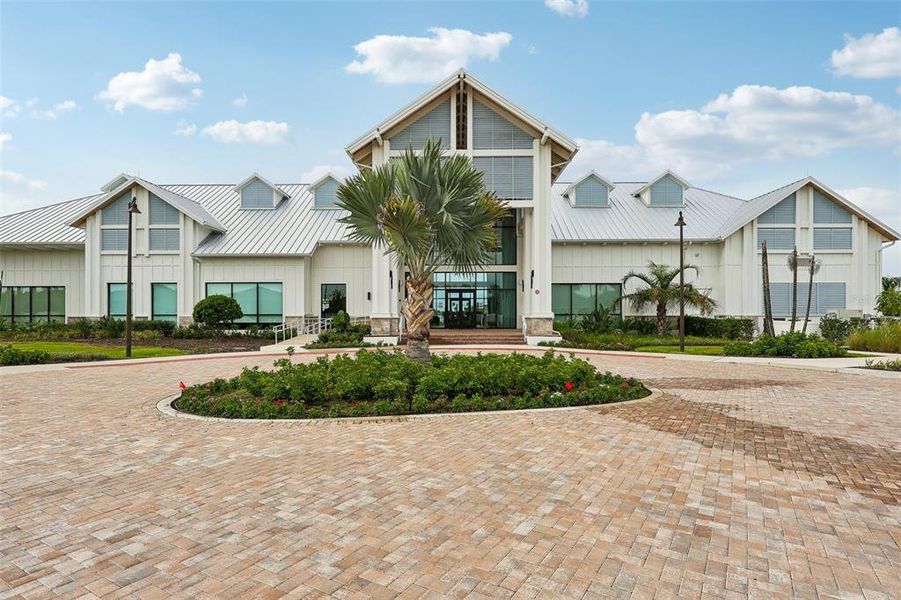 Front exterior of a new home in Del Webb Oasis, Winter Garden, FL, highlighting curb appeal (Image 1). Front exterior of a new home in Del Webb Oasis, Winter Garden, FL, highlighting curb appeal (Image 1).
