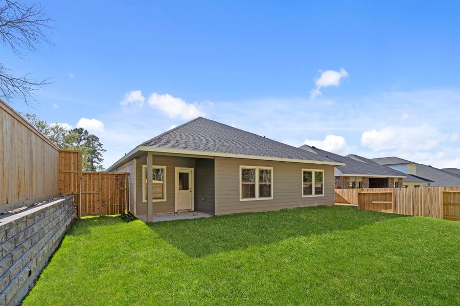 Exterior details and patio area of a home in , Conroe (Image 3).