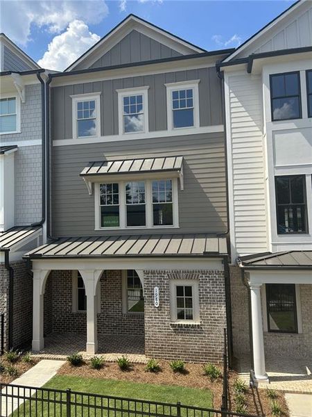 Front exterior of a new home in Devin's Shire - A Kennesaw Tradition, Kennesaw, GA, highlighting curb appeal (Image 22).