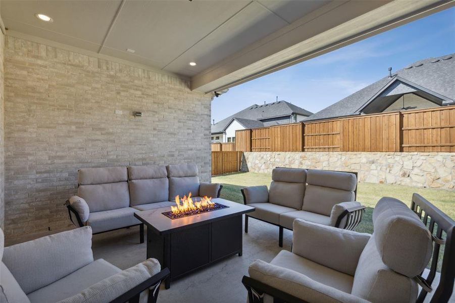 View of patio / terrace featuring an outdoor living space with a fire pit