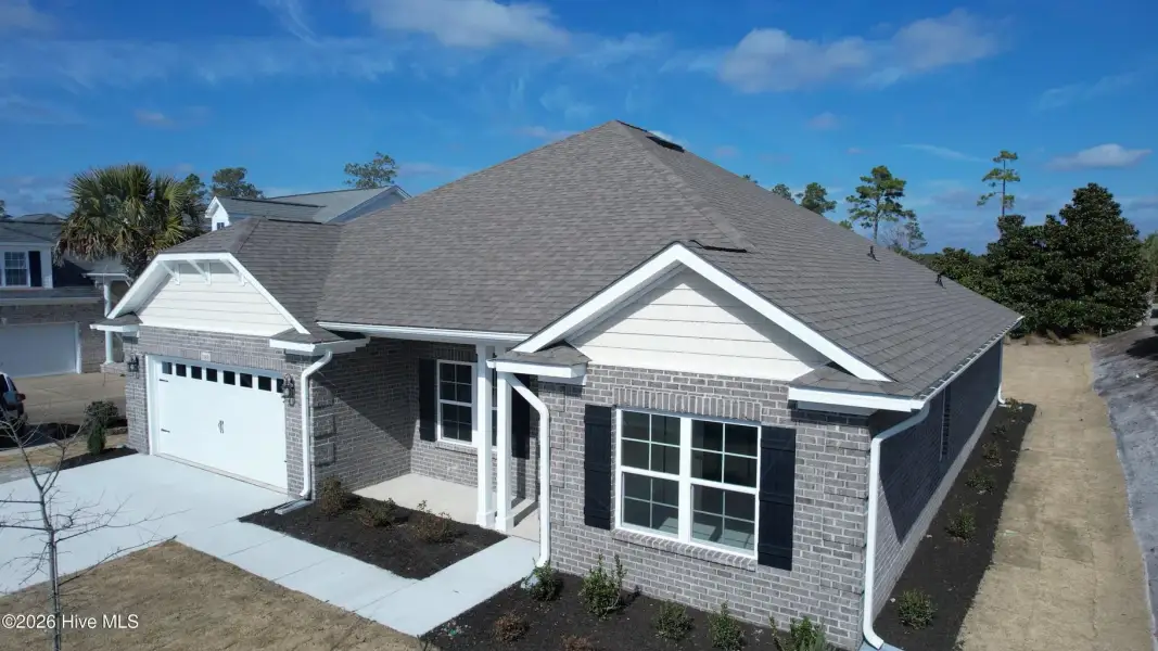 Front exterior of a new home in Palmetto Creek, Bolivia, NC, highlighting curb appeal (Image 21). Front exterior of a new home in Palmetto Creek, Bolivia, NC, highlighting curb appeal (Image 21).