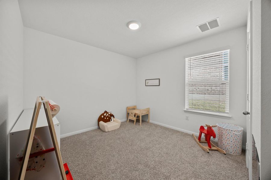 Playroom featuring carpet and baseboards